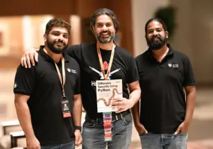 Team members Rejah and Manindar share their new book, Offensive Security using Python, with cybersecurity veteran Aseem Jakhar at c0c0n.