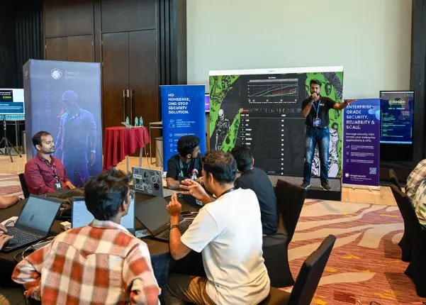 A Beagle Security team member anchoring DomeCTF on stage.