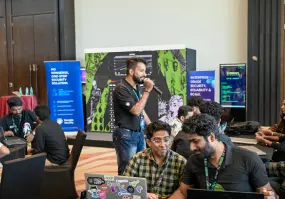 A Beagle Security team member anchoring DomeCTF keeping the crowd going during the event.