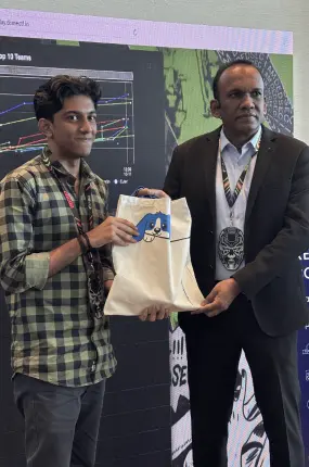 The winner of DomeCTF receiving a token of appreciation from IPS Manoj Abraham Sir.