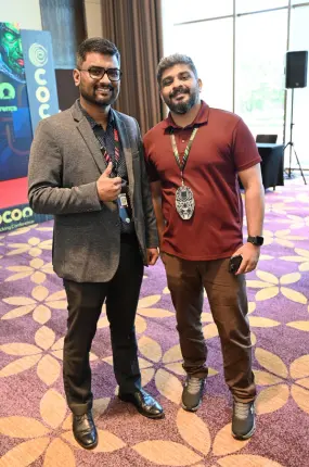 Director Rejah Rehim in a photo with a Beagle Security customer he met at the event.