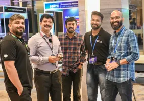 The Beagle Security team members pose for a photo with a well-wisher we met at the event.