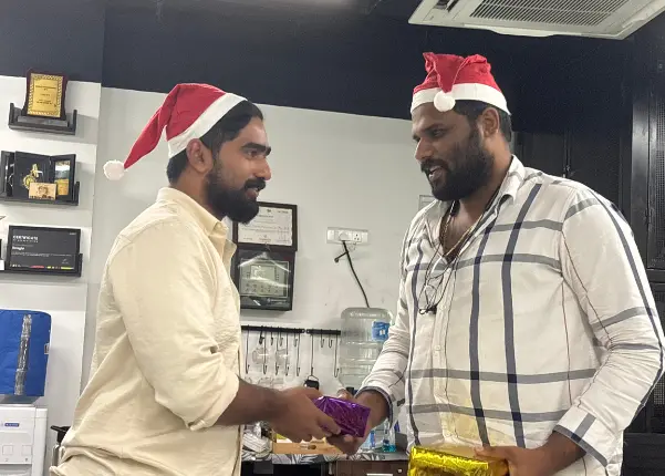 Team members receiving gifts from their secret Santa as part of the celebrations.