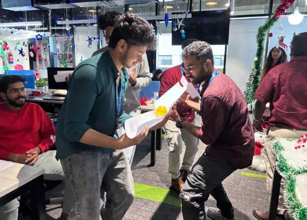 Employees playing a ball not drop game challenge