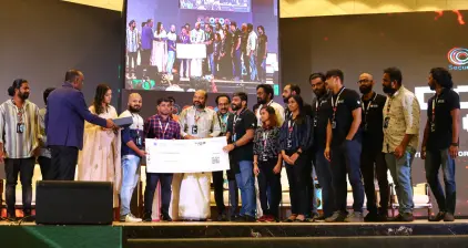 Co founder Rejah Rehim, along with other Beagle Security team members handing over the cash prize to winners of DomeCTF.