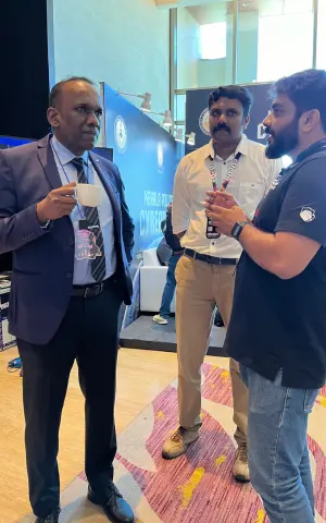 Co founder Rejah Rehim in conversation with Police officer Manoj Abraham Sir whos is sporting the DomeCTF 2023 ID card.
