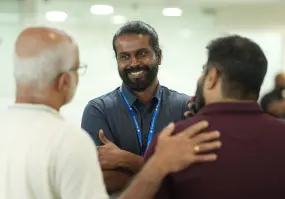 Both of our founders engaged in conversation with an old friend at the event.