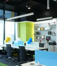 The new office space decorated with balloons for the event.