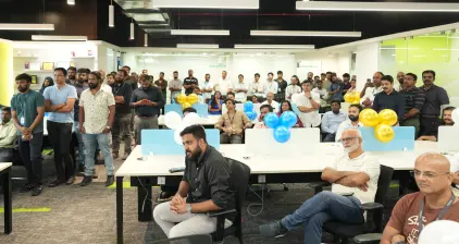 The crowd of well-wishers and friends who had gathered for the event listening to a speech.
