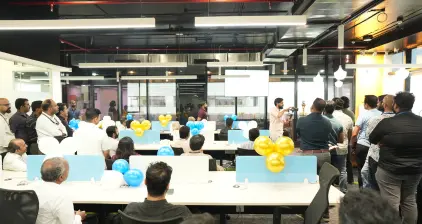 A shot of the new office space with the guests gathered for the event.