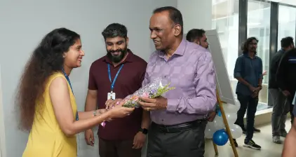 A Beagle team member welcoming the chief guest to the event.