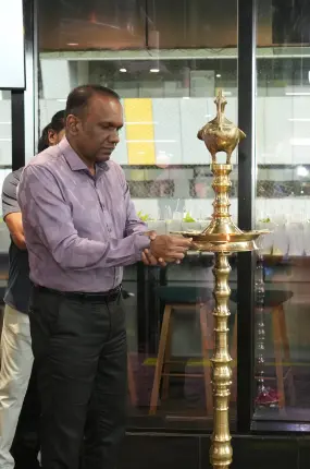 Our chief guest inaugurating the new office by lighting the lamp.