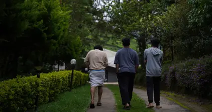 Few team members taking a walk through the serene pathways of the resort.