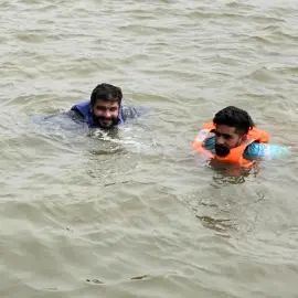 The team taking a dip in the backwaters with the safety of life jackets