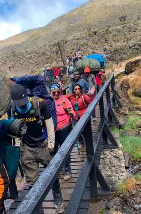 Crossing a bridge along the path to the summit of Mt. Kilimanjaro