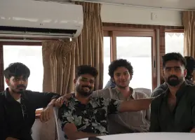 Beagle Security members at Ashtamudi lake on a boat.