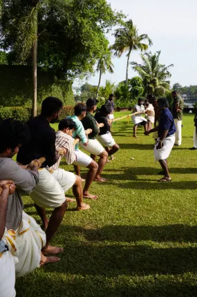 Team members playing tug of war game.