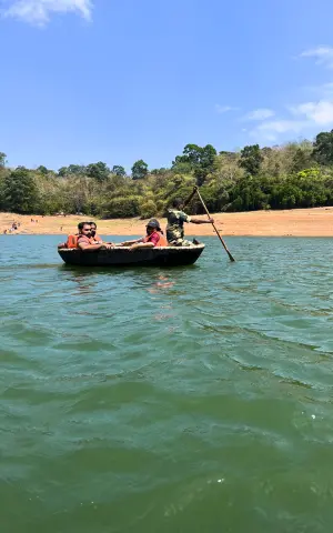 The team enjoying the ride on the coracle boat at Thenmala reservoir.