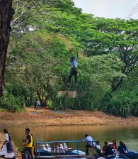 A team member trying out the rope walk at the adventure park at Thenmala.