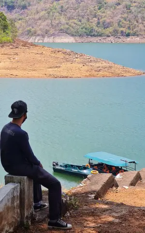 A team member enjoying the sceninc view at Thenmala reservoir.