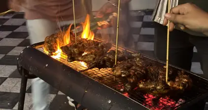 A flame-filled grill as the cooking gets heated.