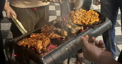 A variety of meat on the grill to be cooked.