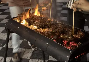 A flame-filled grill as the cooking gets heated.